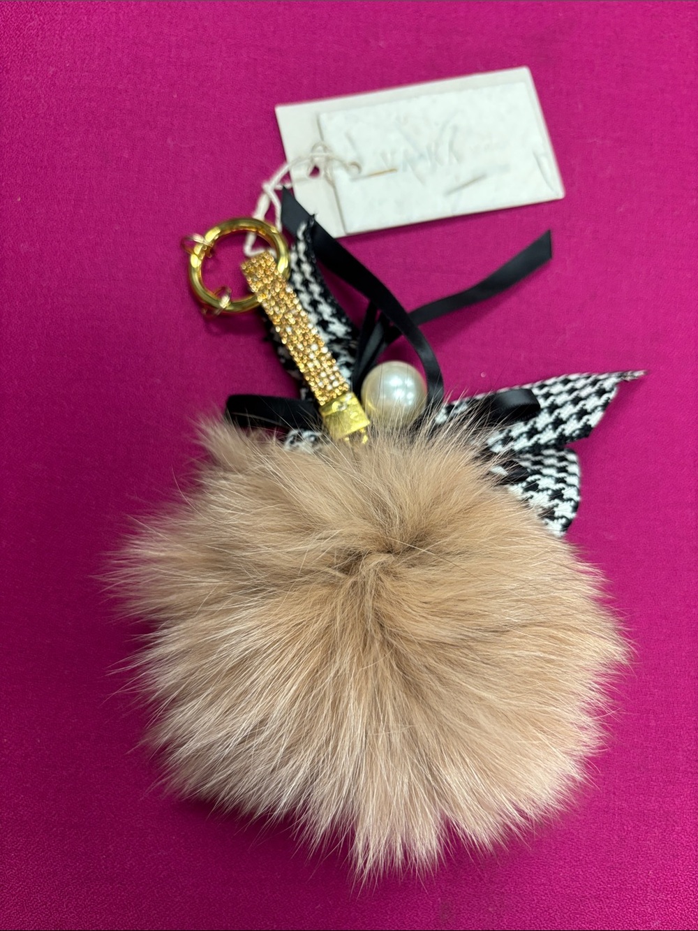 VAKA Fur Pom Pom Keychain with Pearl & Ribbon Accent tan color